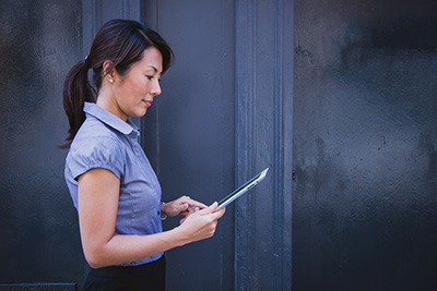 Woman reading from tablet
